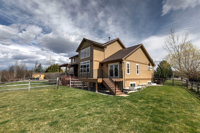2200 Rafferty Ln, Missoula, MT 59804 - rear view of property with stairs, a fenced backyard, and a deck