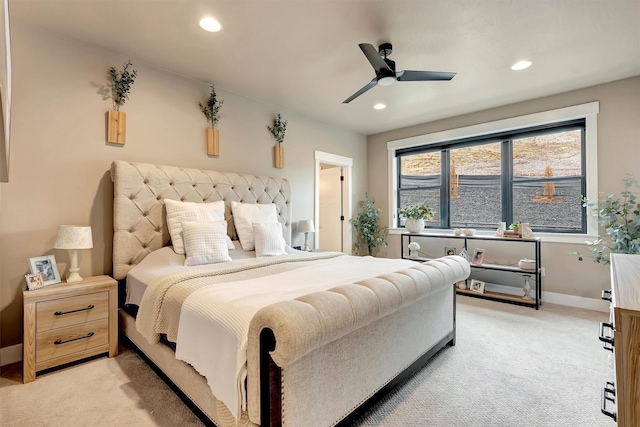 bedroom featuring light colored carpet, baseboards, and recessed lighting