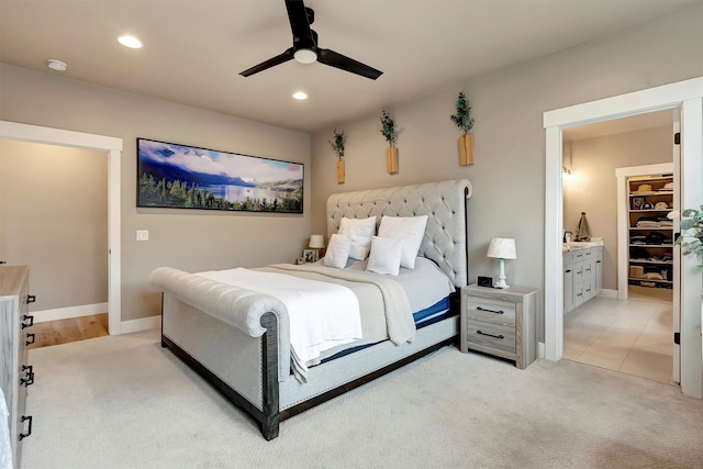 bedroom with recessed lighting, ceiling fan, baseboards, and light carpet