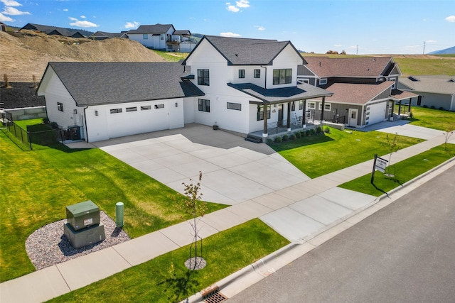 7038 Max Dr, Missoula, MT 59803 - modern inspired farmhouse with a porch, concrete driveway, roof with shingles, a residential view, and an attached garage
