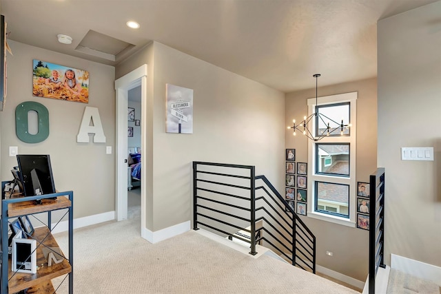 interior space featuring baseboards and an inviting chandelier