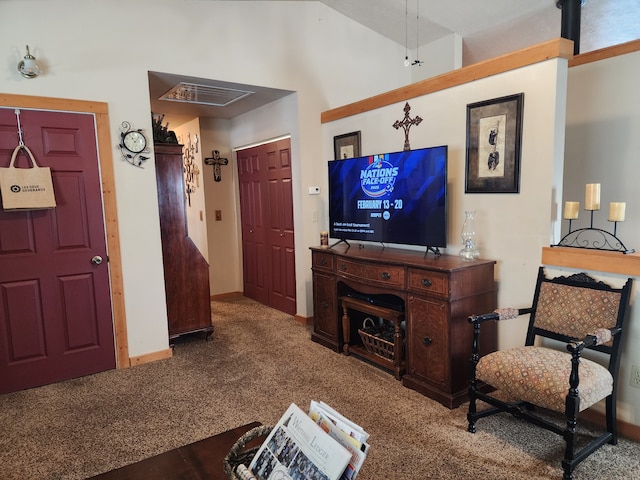carpeted living area featuring baseboards and visible vents