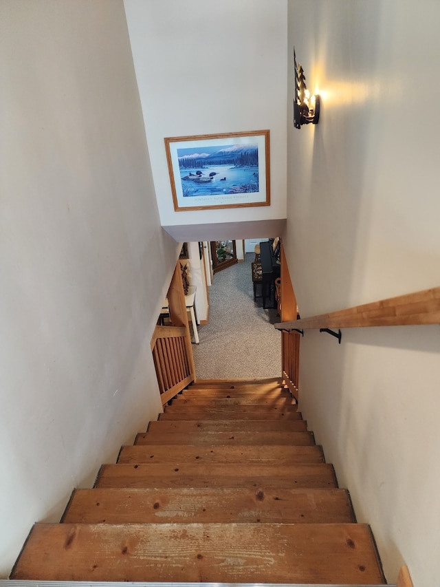 stairs with wood finished floors