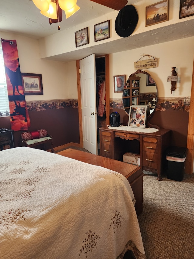 bedroom featuring wainscoting