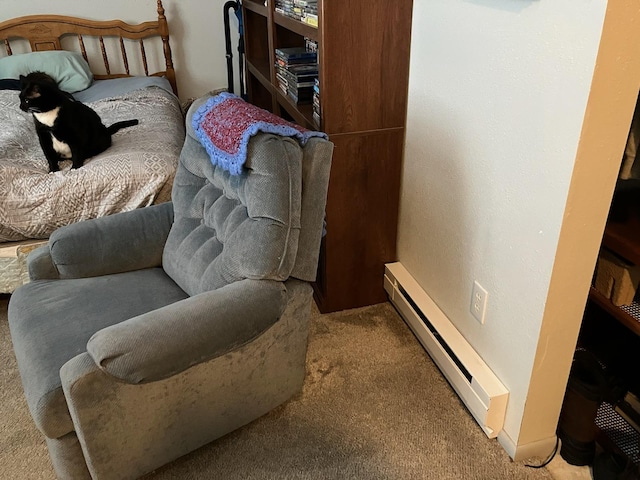 carpeted bedroom featuring baseboard heating