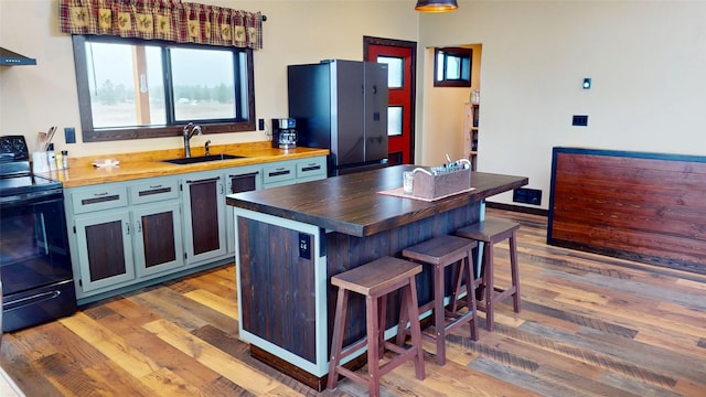 87 Velvet Grv, Eureka, MT 59917 - kitchen with wood counters, black appliances, and light wood-style floors