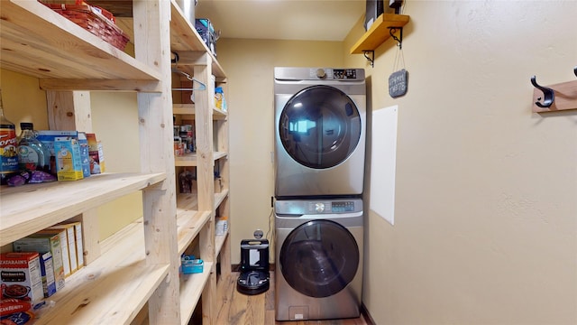 87 Velvet Grv, Eureka, MT 59917 - laundry room with stacked washer / dryer and wood finished floors