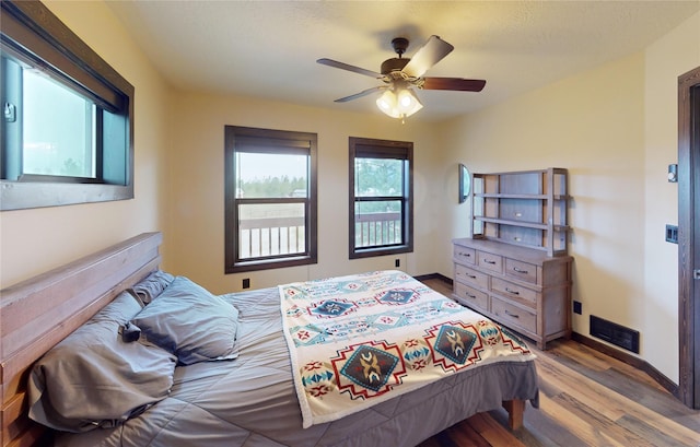 87 Velvet Grv, Eureka, MT 59917 - bedroom featuring wood finished floors and a ceiling fan