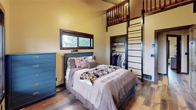 87 Velvet Grv, Eureka, MT 59917 - bedroom featuring wood finished floors and a high ceiling