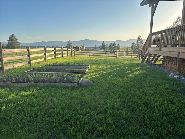 87 Velvet Grv, Eureka, MT 59917 - view of yard featuring a mountain view, a vegetable garden, and a rural view