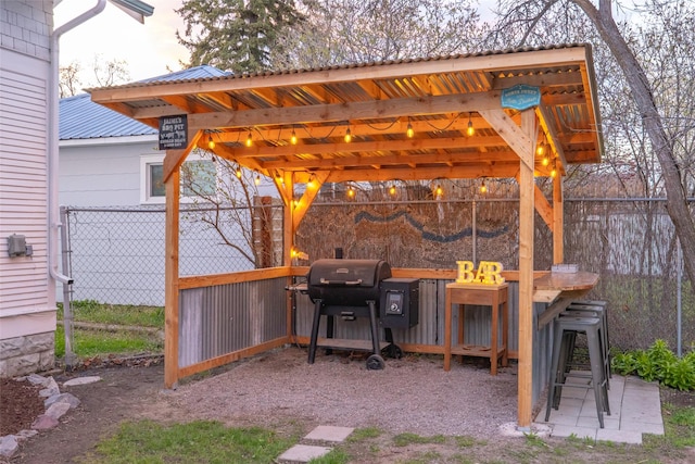 view of patio with grilling area and fence