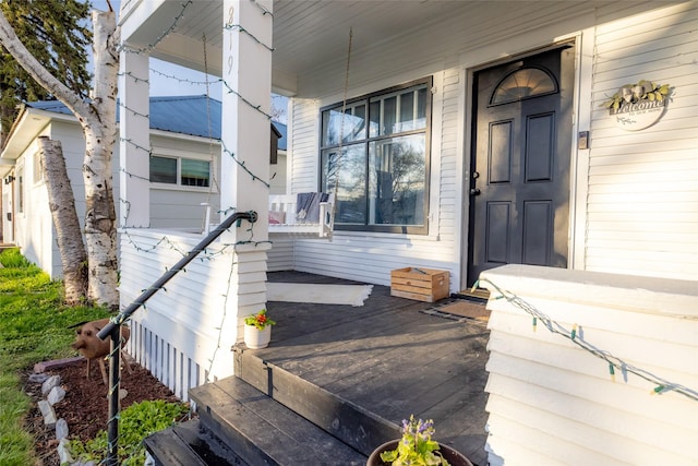 doorway to property with a porch