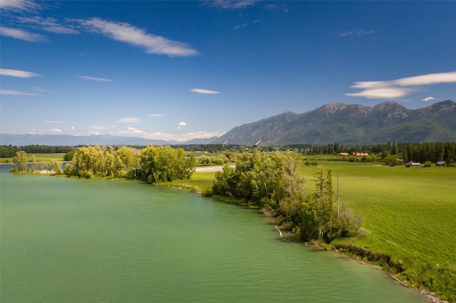 surrounding community featuring a water and mountain view