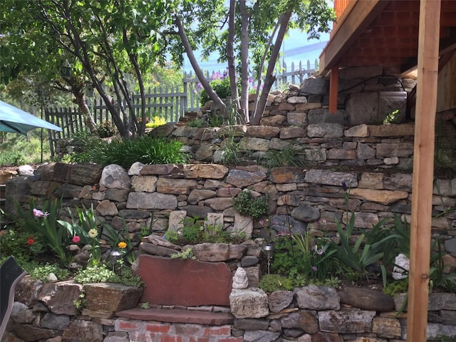 exterior space featuring stone siding