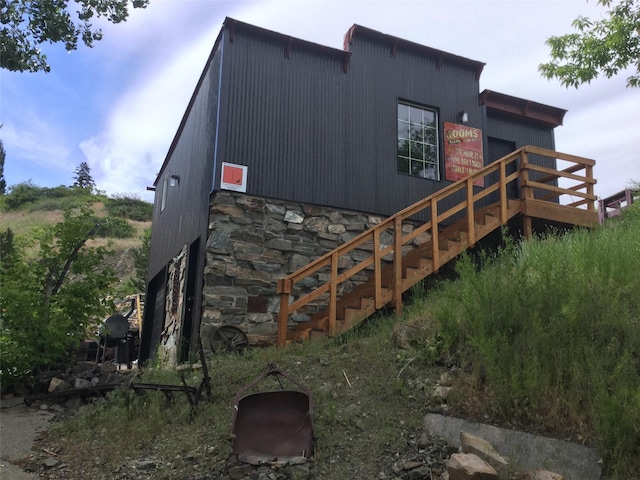 exterior space featuring stone siding