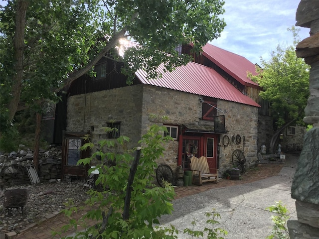 view of front of home with stone siding