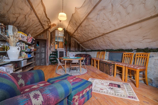 interior space with wood-type flooring and lofted ceiling