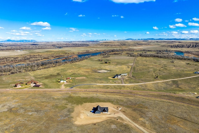 birds eye view of property with a rural view and a mountain view