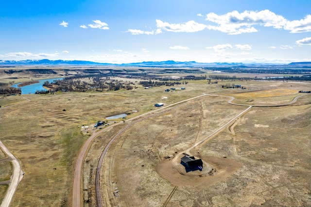 bird's eye view featuring a rural view and a water and mountain view