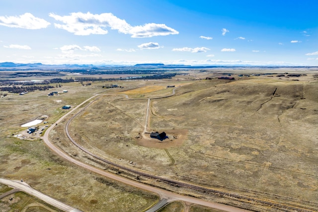 birds eye view of property with a rural view and a mountain view