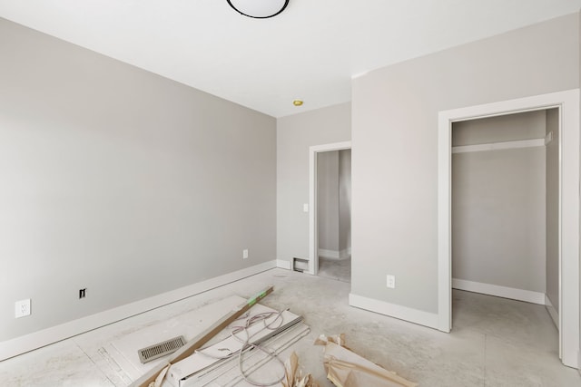 unfurnished bedroom featuring baseboards and visible vents