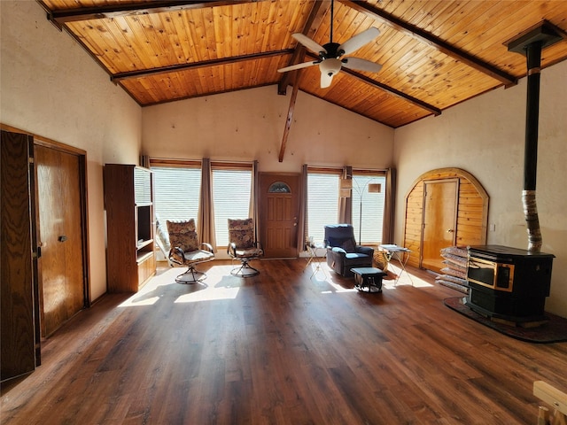 sitting room with high vaulted ceiling, a wood stove, wooden ceiling, and beam ceiling