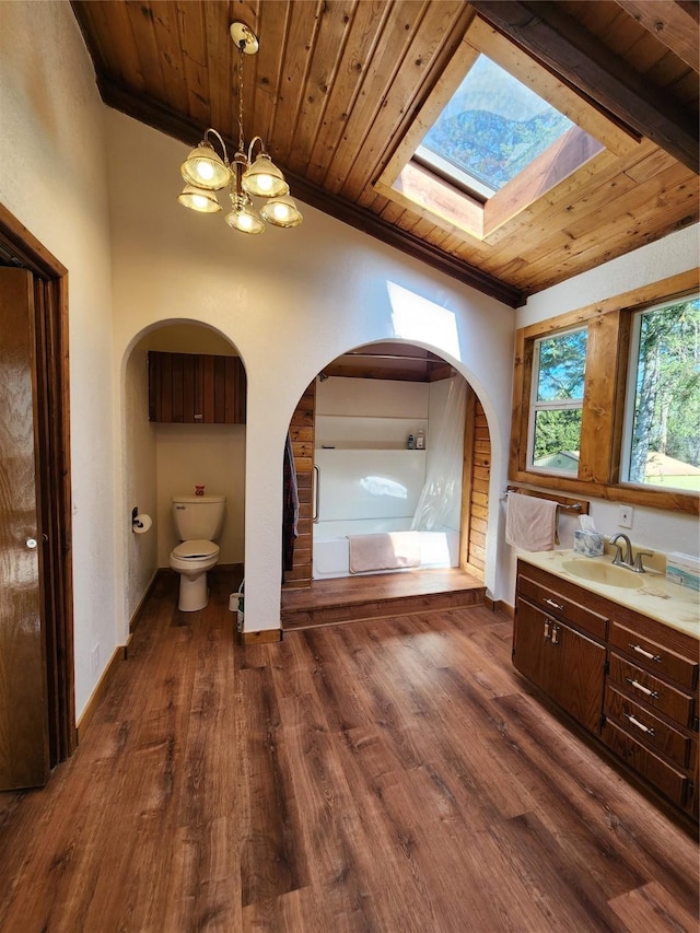 full bath with wood ceiling, toilet, vanity, and a chandelier