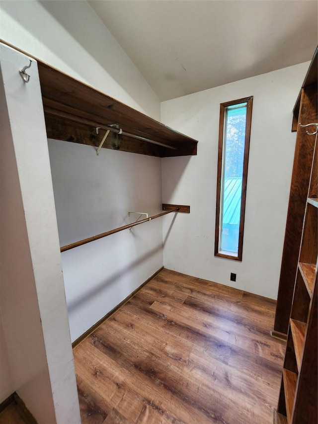 spacious closet with wood finished floors