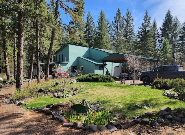 exterior space with a yard and a carport