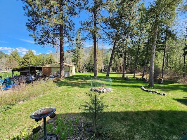 view of yard with an outbuilding and a pole building