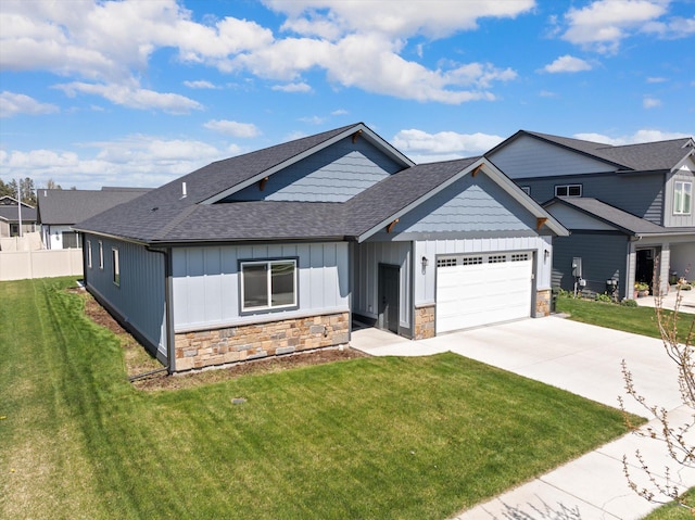 3019 Elderberry Ave, Kalispell, MT 59901 - craftsman inspired home with board and batten siding, roof with shingles, a garage, concrete driveway, and stone siding
