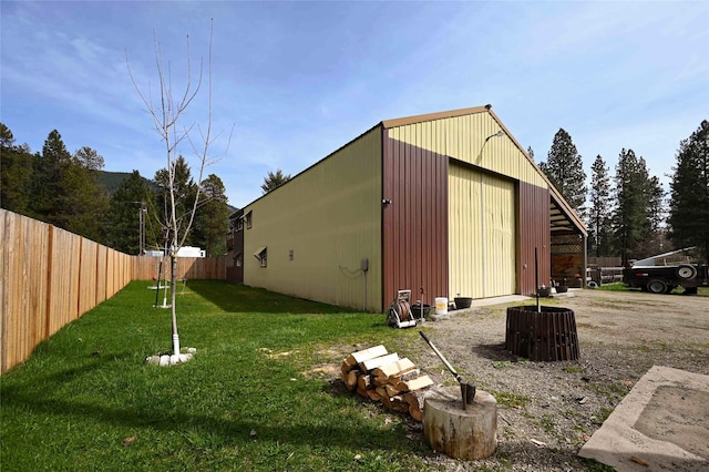 57 Fir St, Trout Creek, MT 59874 - view of pole building with central air condition unit, fence, and a lawn