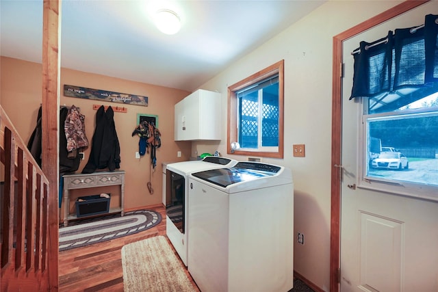 57 Fir St, Trout Creek, MT 59874 - clothes washing area featuring cabinet space, light wood-type flooring, washer and clothes dryer, and healthy amount of natural light