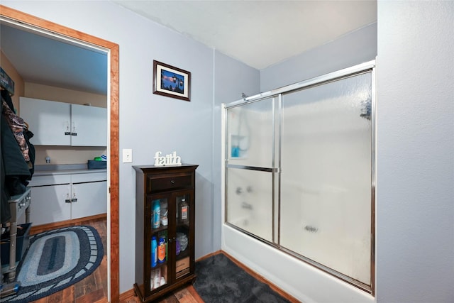 57 Fir St, Trout Creek, MT 59874 - bathroom featuring combined bath / shower with glass door, vanity, and wood finished floors