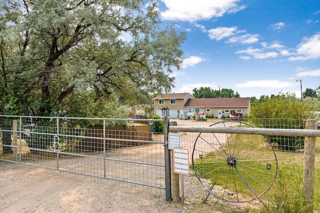 view of gate with fence