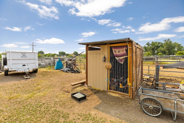 view of poultry coop featuring fence