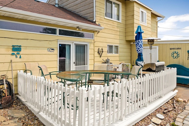 wooden deck featuring outdoor dining space