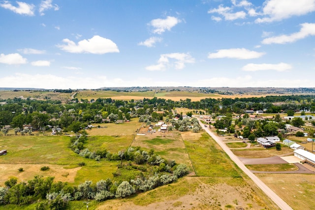 birds eye view of property with a rural view