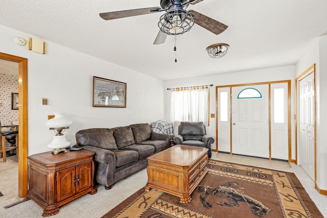 living room featuring light colored carpet and ceiling fan