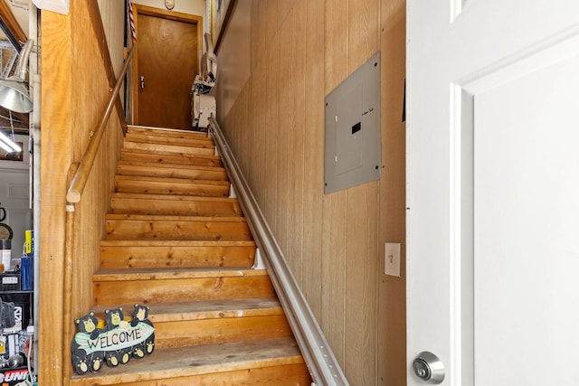 staircase featuring electric panel