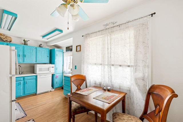 dining space featuring ceiling fan and light wood finished floors