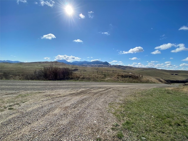 view of mountain feature with a rural view