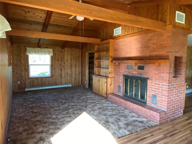 unfurnished living room featuring a baseboard heating unit, visible vents, wood walls, and wood ceiling