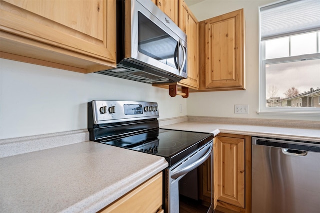 2537 Freedom Loop, Missoula, MT 59808 - kitchen with stainless steel appliances, light countertops, and light brown cabinets