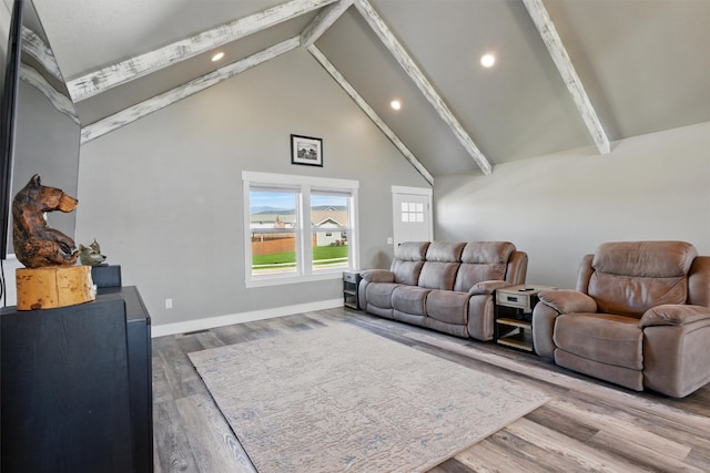 living room with baseboards, recessed lighting, beamed ceiling, wood finished floors, and high vaulted ceiling