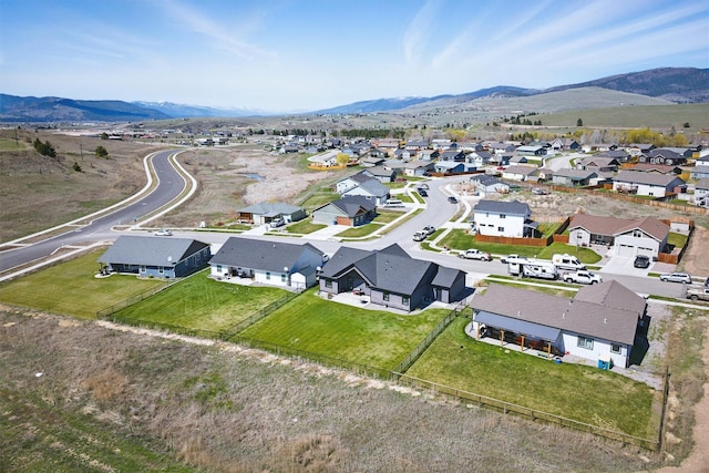 drone / aerial view with a residential view and a mountain view
