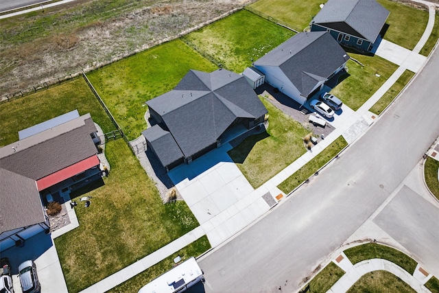 birds eye view of property with a residential view