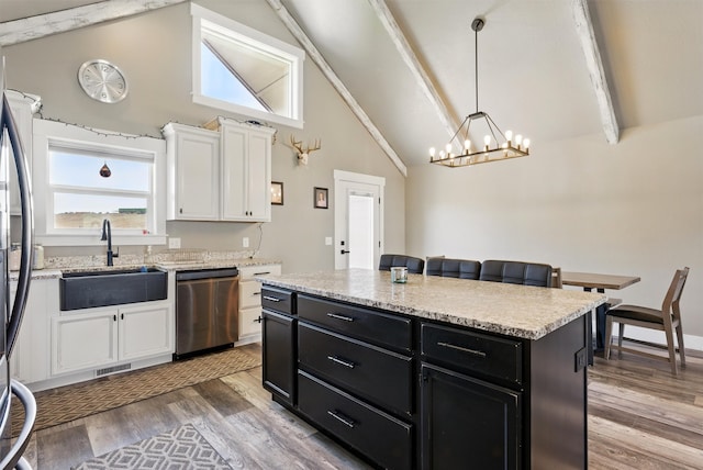 kitchen with dishwasher, white cabinetry, dark cabinetry, and a sink