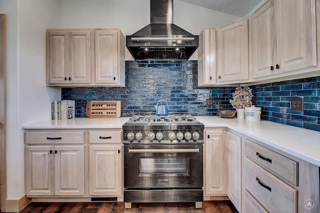 3570 Juniper Dr, Helena, MT 59602 - kitchen featuring high end stainless steel range, wall chimney range hood, and tasteful backsplash