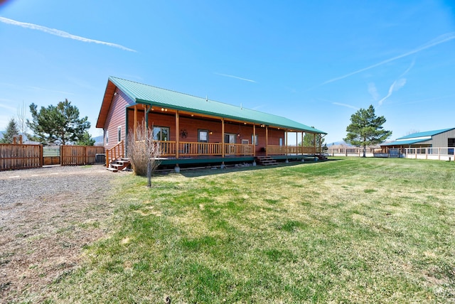 3570 Juniper Dr, Helena, MT 59602 - rear view of property with a metal roof and a deck